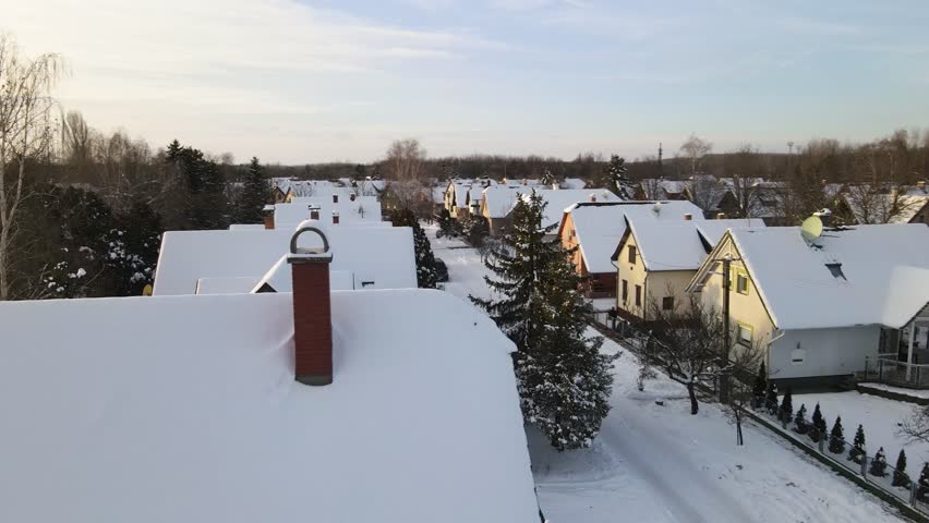 Houses in a residential area of Kiskunmajsa, Hungary, blanketed by snow during winter