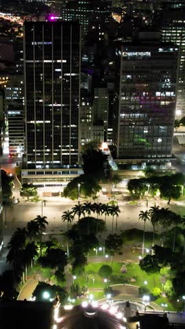 Night scape downtown Sao Paulo Brazil. Cityscape of Sao Paulo Brazil at night. Night metropolis landscape of landmark downtown city. Building and avenue at historic center of city.