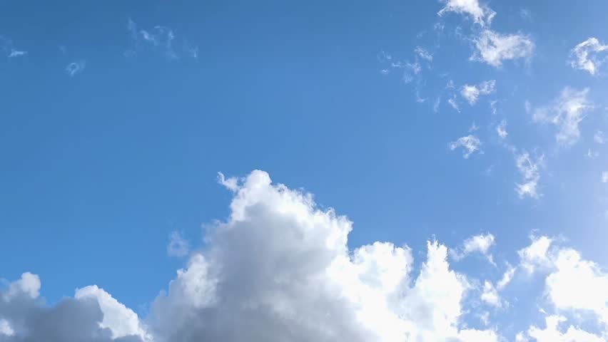 Bright cumulonimbus are growing in the sky