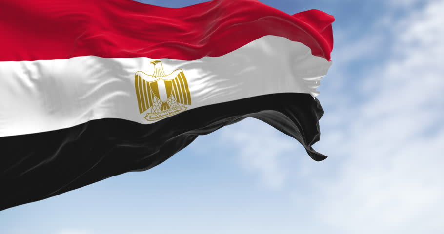 Egypt national flag waving on a clear day. Horizontal red, white and black bands. Egyptian eagle emblem centered in white band. Seamless 3d render animation. Slow motion loop. Selective focus