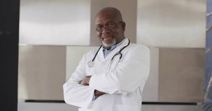 Senior male doctor standing clinic receiving data panels updating patient monitoring charts smiling. Medical professional, technology integration, digital health, healthcare analytics, modern clinic, - Powered by Shutterstock - Get 15% off with code: PIKWIZARD15