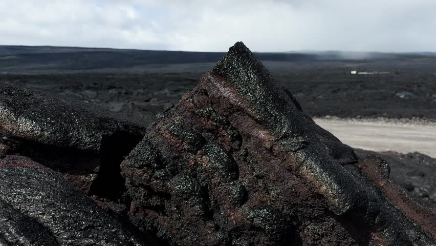 Close-up of layered lava rock on volcanic beach in Kalapana, Hawaii