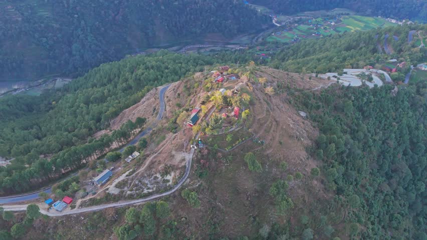 Aerial view of a Jajarkot village shows rural homes scattered across hills and valleys. The landscape reflects traditional living, remote geography, and the natural beauty of western Nepal.