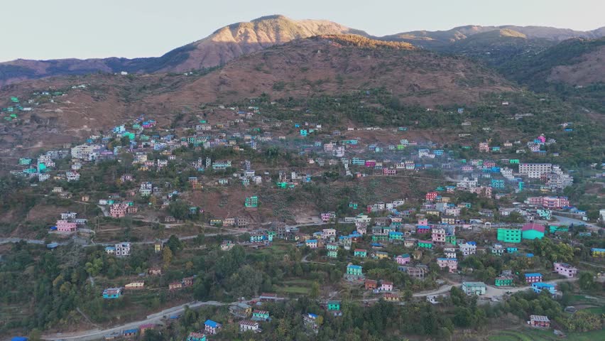 Aerial view of a Jajarkot village shows rural homes scattered across hills and valleys. The landscape reflects traditional living, remote geography, and the natural beauty of western Nepal.