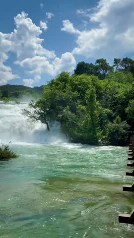 Powerful waterfalls of Krka National Park in Croatia surrounded by lush greenery. Scenic freshwater cascades showcasing pure nature, eco tourism and famous travel destination.