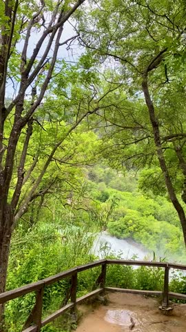 Panoramic view of Krka National Park waterfall in Croatia surrounded by lush greenery. Scenic freshwater cascades showcasing pure nature, eco tourism and famous travel destination.