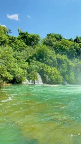 Powerful waterfalls of Krka National Park in Croatia surrounded by lush greenery. Scenic freshwater cascades showcasing pure nature, eco tourism and famous travel destination.
