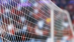 This video documents the physical impact of a soccer ball hitting the interior of a goal net. The visual captures the tension of the netting as it absorbs the ball's momentum, representing a scored goal in a football match. The scene illustrates athletic equipment and the conclusion of an offensive play in a professional or recreational sports setting in high resolution. - Powered by Shutterstock - Get 15% off with code: PIKWIZARD15