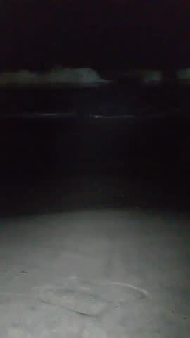 Dark stormy ocean waves at night dramatic scene