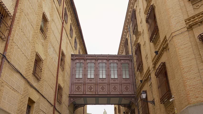 Medieval passageway between ancient buildings of the Unesco city of Toledo, Spain.