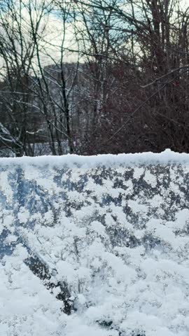 A snowy winter path leads across Volodymyr’s Hill toward the monument to King Volodymyr, overlooking the city in Kyiv, Ukraine