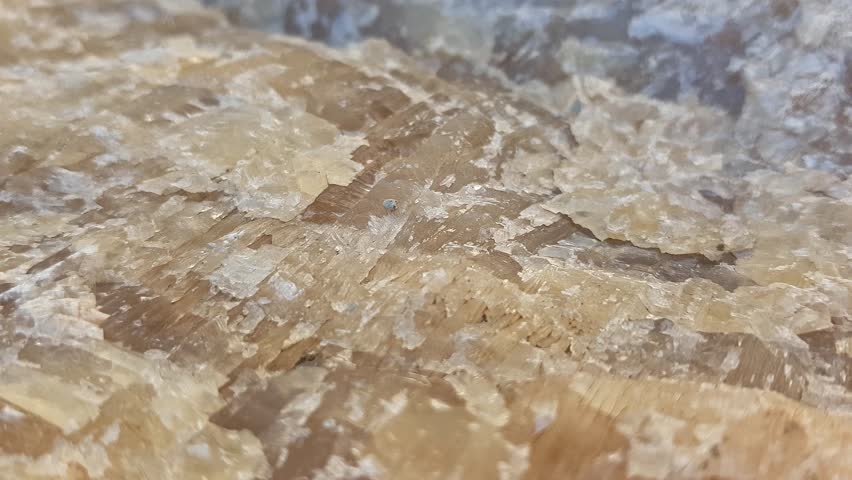 A detailed close-up of raw barite revealing each distinctive formation and texture, set in an authentic environment to emphasize the mineral