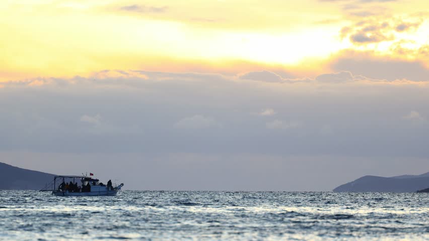 boat on the sea. A fishing boat sailing in the evening.. Turgutreis, bodrum, turkey.