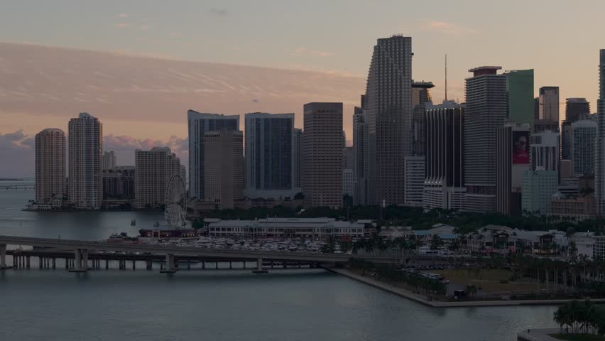 Aerial view of the Gulf in the afternoon with an orange sky and a view of the city of Miami, Florida, United States