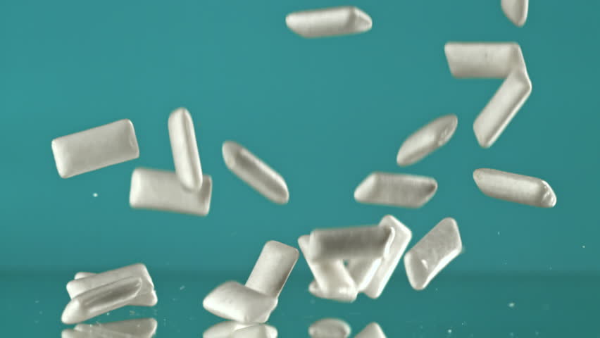 Chewing gum falls on the table. Filmed on a high-speed camera at 1000 fps. High quality FullHD footage