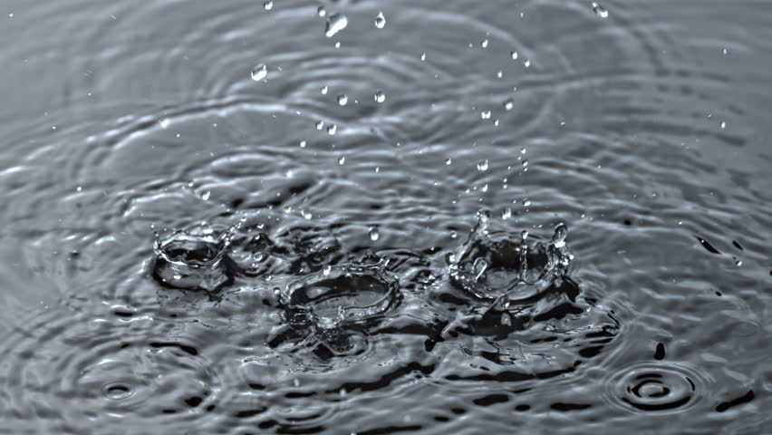 Super slow motion falling raindrops . Filmed on a high-speed camera at 1000 fps. High quality FullHD footage