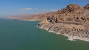 drone aerial perspective of the crystalline salt formations and vibrant turquoise mineral waters along the Jordanian shores of the Dead Sea - Powered by Shutterstock - Get 15% off with code: PIKWIZARD15