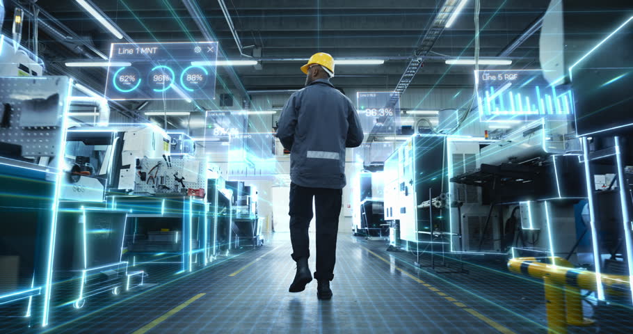Male Factory Worker Through Modern Production Hall as AR Dashboards and Digital Twin Overlays Map Machines, Track KPI Percentages, Visualize Iot Data. Industry 4.0 Smart Manufacturing, Automation