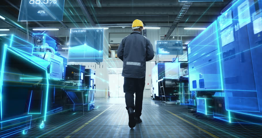 Black Male Technician Walks Down a High-tech Factory Aisle as Holographic AR Panels and Digital Twin Grids Scan Equipment, Display Kpi Charts, Stream Iot for Smart Manufacturing, Automation