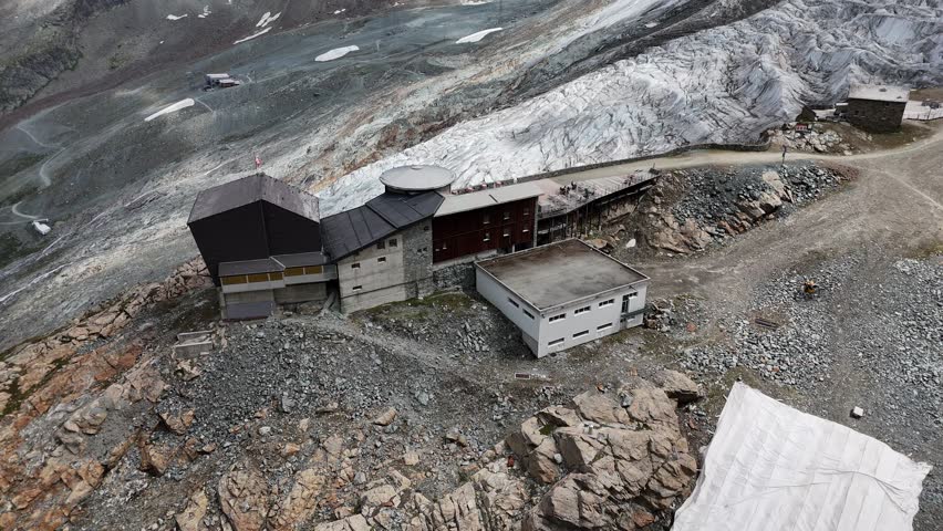 Saas-Fee Längfluh drone video with the glacier and gondola during Summer, Valais Wallis, Swiss Alps, Switzerland