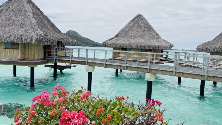 Summer Bora Bora Vacation Resort in French Polynesia with turquoise and aquamarine shallow lagoon clear water