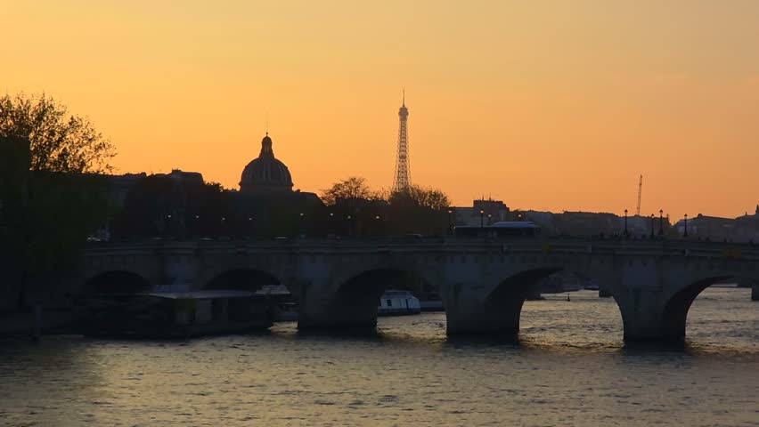 Sunset Over Seine River and Historic Bridge in Paris, France