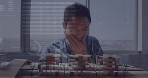Animation of statistical data processing over asian engineer working on his model at office. Business data and architectural engineering technology concept - Powered by Shutterstock - Get 15% off with code: PIKWIZARD15