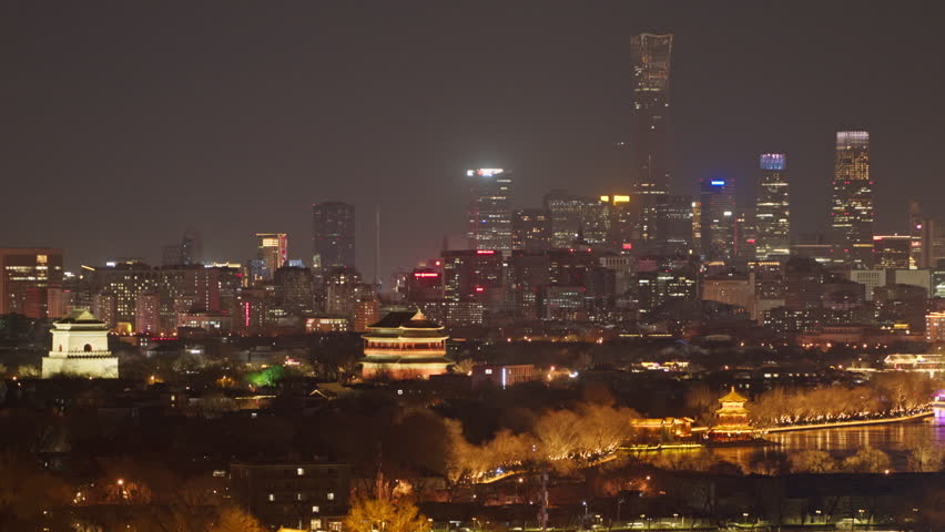 Beijing night view: Ancient Bell and Drum Towers illuminated for Spring Festival, with the CITIC Tower and CBD skyline in a "Old meets New" contrast