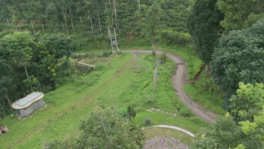 Serene Mountain Landscape with Lush Greenery, Curved Road, and Tranquil Gazebo Viewpoint Argopuro East Java