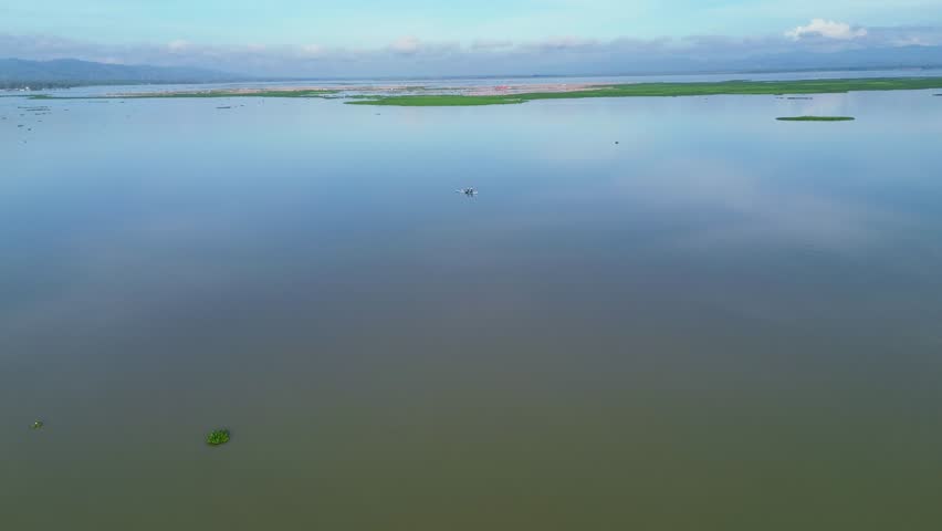 Aerial View of a Boat on a Wide Lake