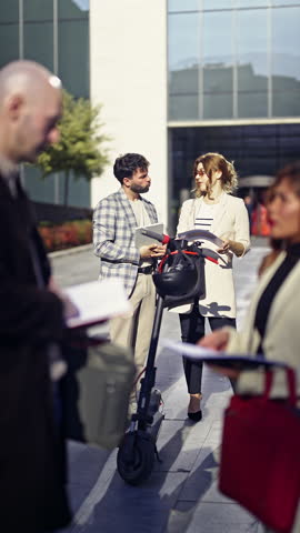 Multicultural Business Professionals in a City Meeting Discussing Charts and Graphs Outdoors