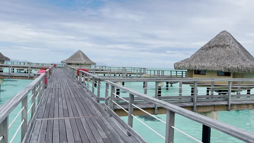 Summer Bora Bora Vacation Resort in French Polynesia with turquoise and aquamarine shallow lagoon clear water