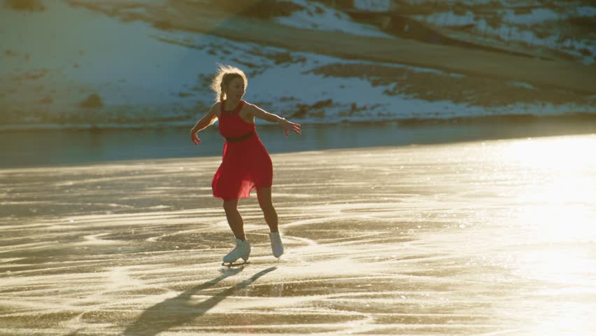 A Young Figure Skater Gracefully Gliding on Ice, Embraced by Golden Hour Light, Showcasing Joy and Elegance Amidst a Serene Winter Landscape, Capturing the Artistic Movement of the Sport