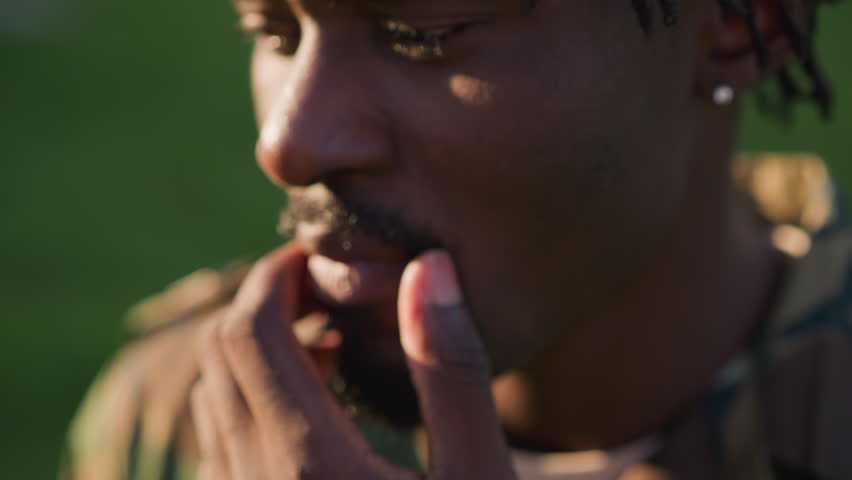 Soldier Reflects Outdoors, Individual In Disguise Pauses In Park To Recall Homeland, Camouflaged Personnel Standing In Sunlit Park Quietly Contemplating Personal Memories Of Their Native Land