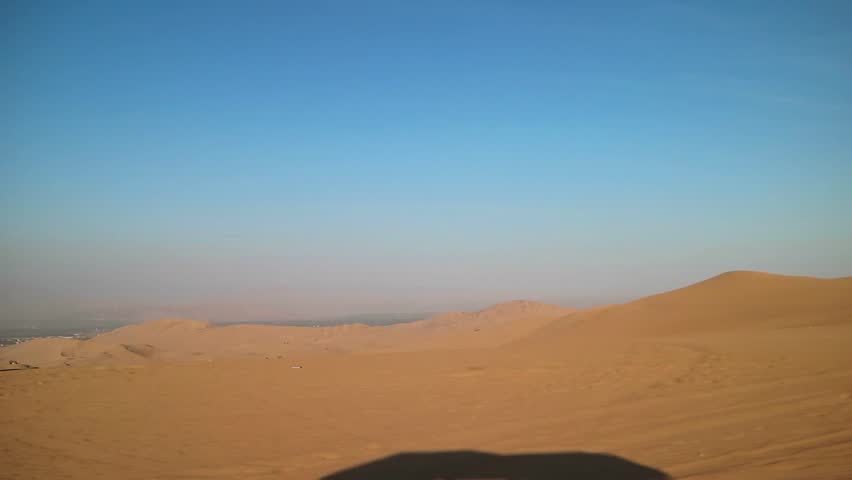 Footage of amazing Huacachina sand dunes as seen while riding on dune buggy in Ica region, Peru, South America
