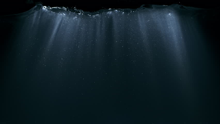 Super Slow Motion of Underwater Sun Rays Shimmering Through Dark Water at 1000fps.