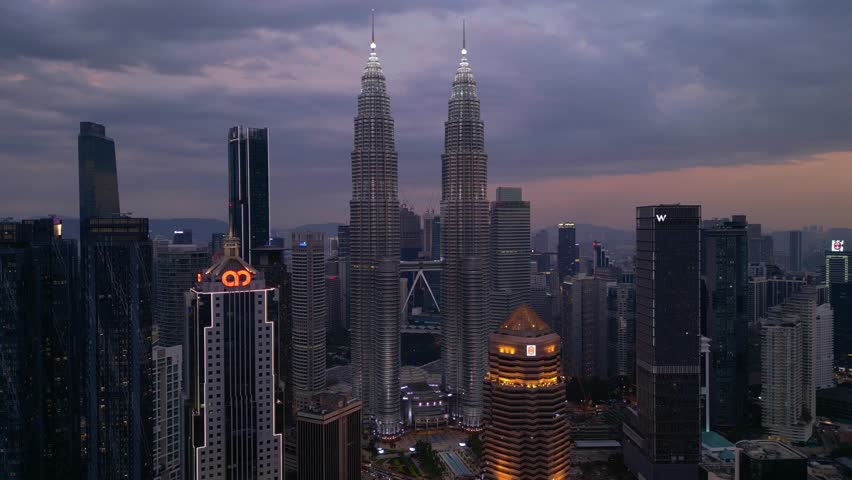 Petronas Twin Towers Kuala Lumpur at night. Perfect aerial view drone