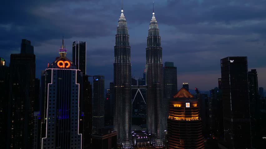 Petronas Twin Towers Kuala Lumpur at night. Best aerial view drone