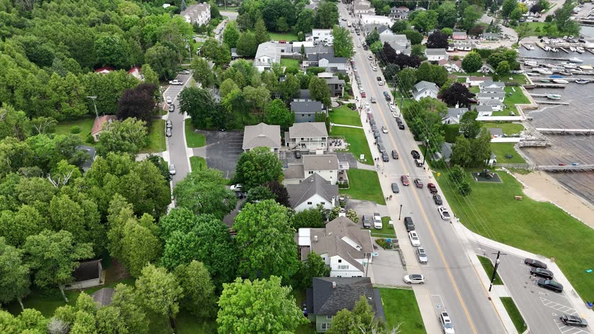 Aerial of Fish Creek in Door County Wisconsin on an overcast day.  Dynamic pulling drone shot of Main Street.