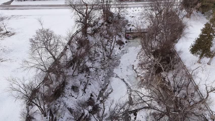 High Drone Orbital shot of Frozen Waterfall in Green Bay Wisconsin.