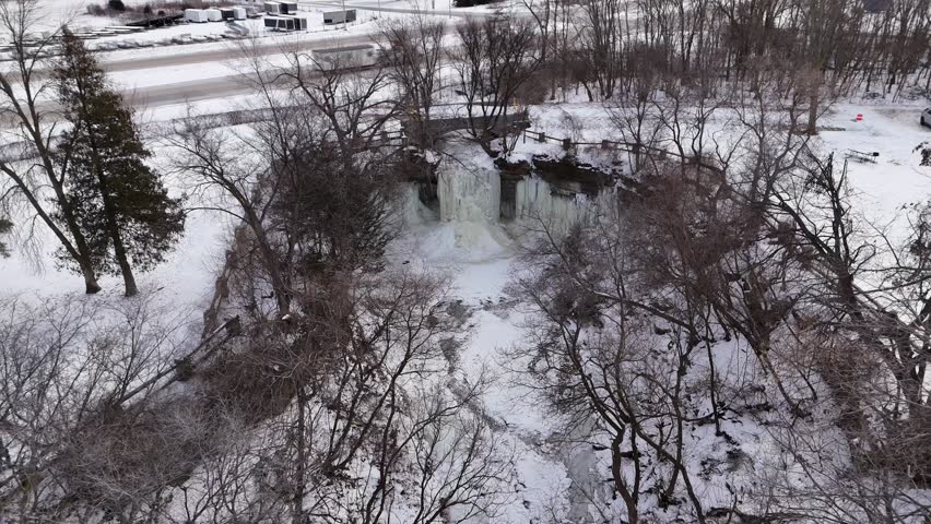 High Drone Orbital shot of Frozen Waterfall in Green Bay Wisconsin.