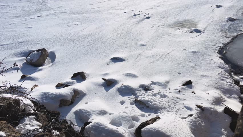 A wonderful view of a frozen lake on a frosty sunny day