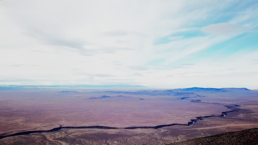 Rio Grande Gorge with clouds, Desert Mesa, American Southwest Landscape, Taos New Mexico, 4K Drone Aerial