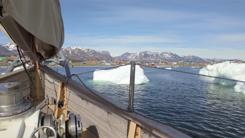 Sailing past an iceberg near Saqqaq, Greenland