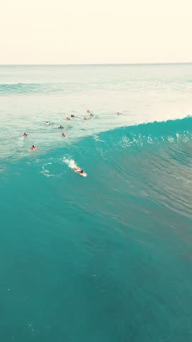 Cinematic vertical drone video of surfer at Cloud 9 in Siargao.