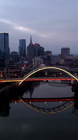 Vertical Flyover Of The Cumberland River And Downtown Nashville Skyline At Blue Hour In Tennessee, USA.
