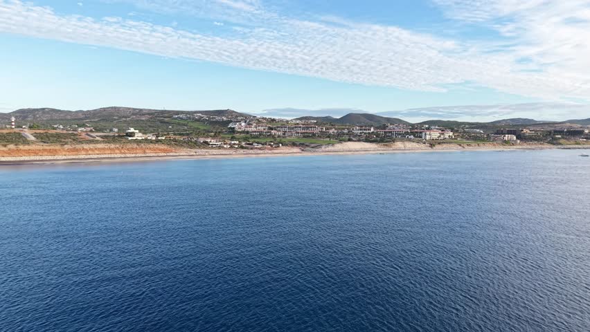 Forward drone movement to the distant shoreline of San José del Cabo coastal city, Mexico