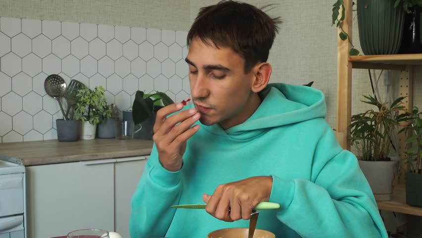 a man has dinner at home after work