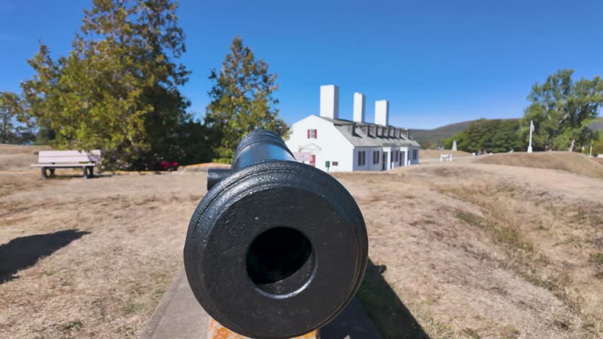 Slow motion footage the town of Annapolis Royal in Nova Scotia Canada showing a canon with the camera going inside the canon