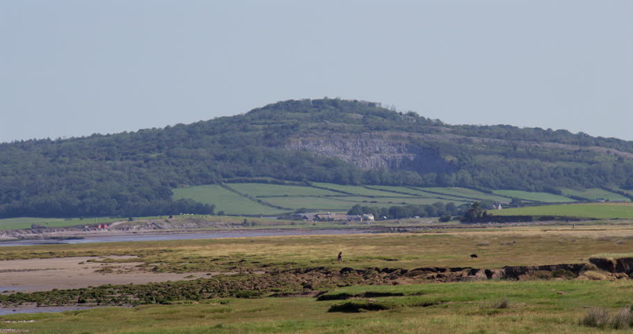 Wides shot looking up the Kent Estuary with Warton Crag limestone cliffs. Taken at Bolton le Sands, The shore car park.
